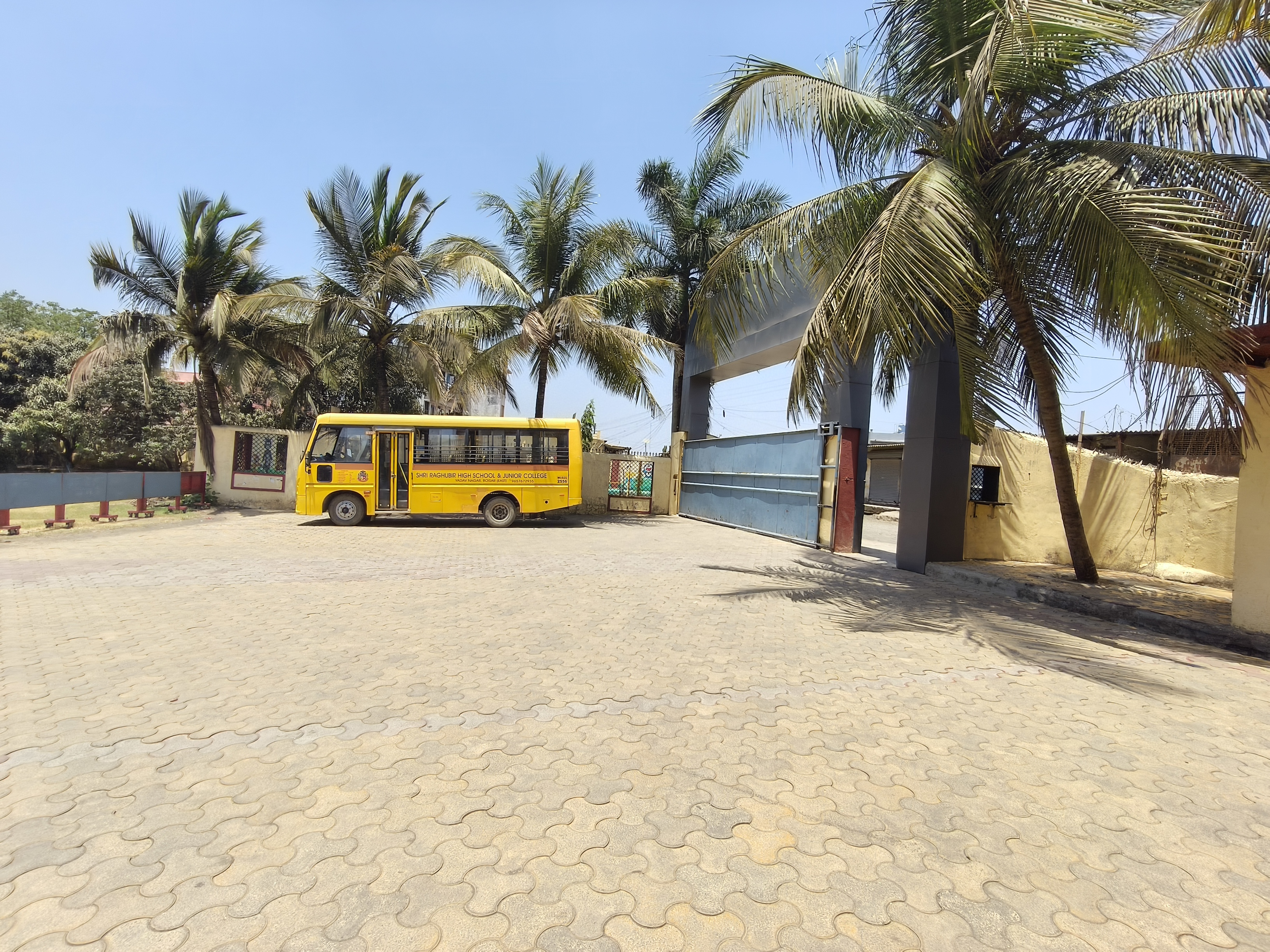 School bus parked near the entrance gate