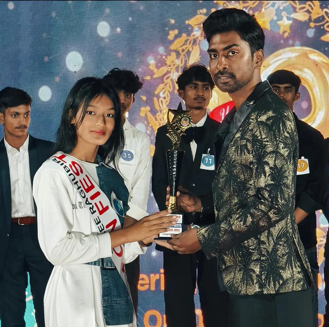 Students receiving a trophy during an award function